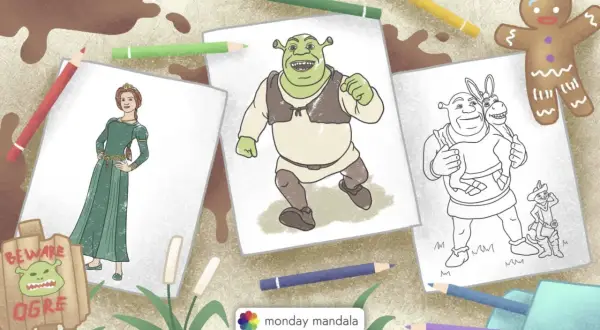 Jak narysować Shreka? Na stole leżą szkice postaci z bajki: Shrek, Fiona, Osioł i Kot w Butach. Obok kolorowe kredki i piernikowy ludzik.